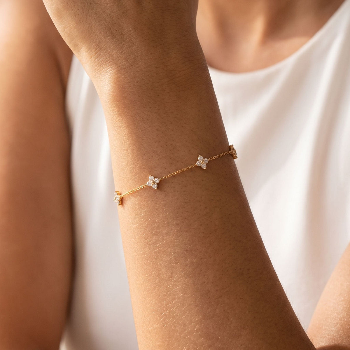 Crystal Clover Bracelet worn on the wrist, photographed in natural daylight.