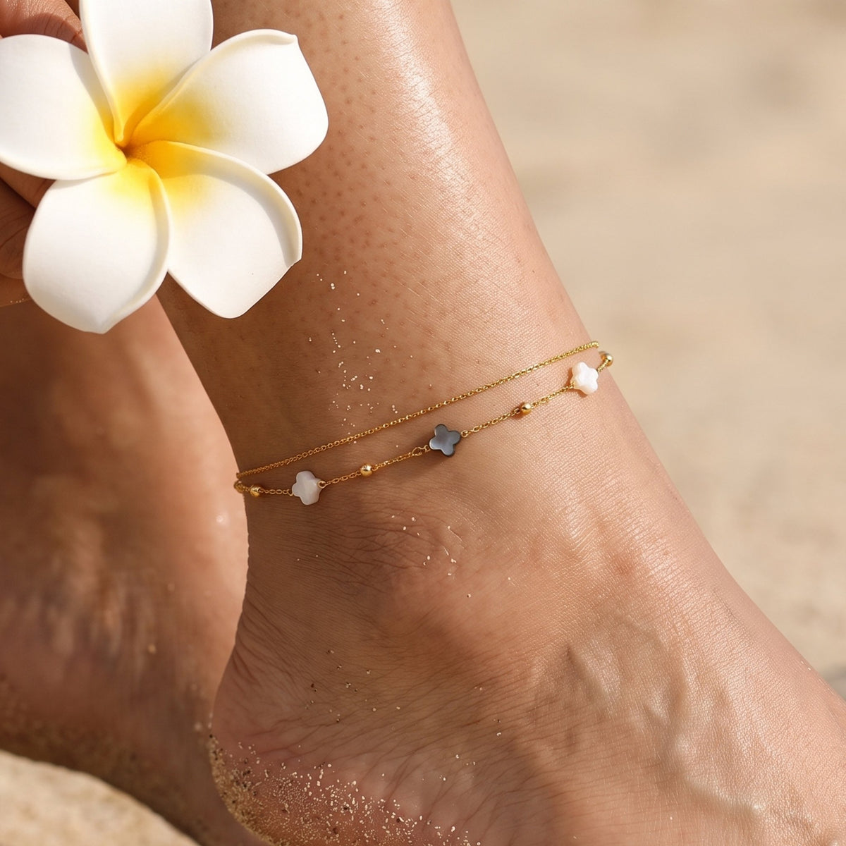 Close-up of the Domino Anklet worn on the ankle
