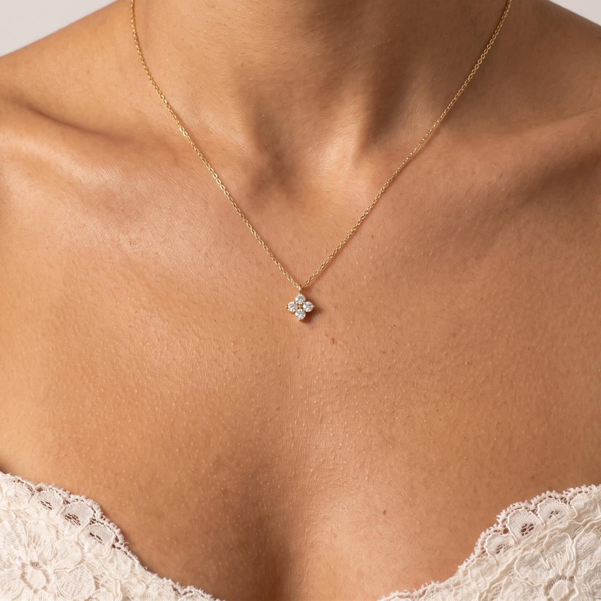 Close-up of the Four Petal Necklace worn on the neckline