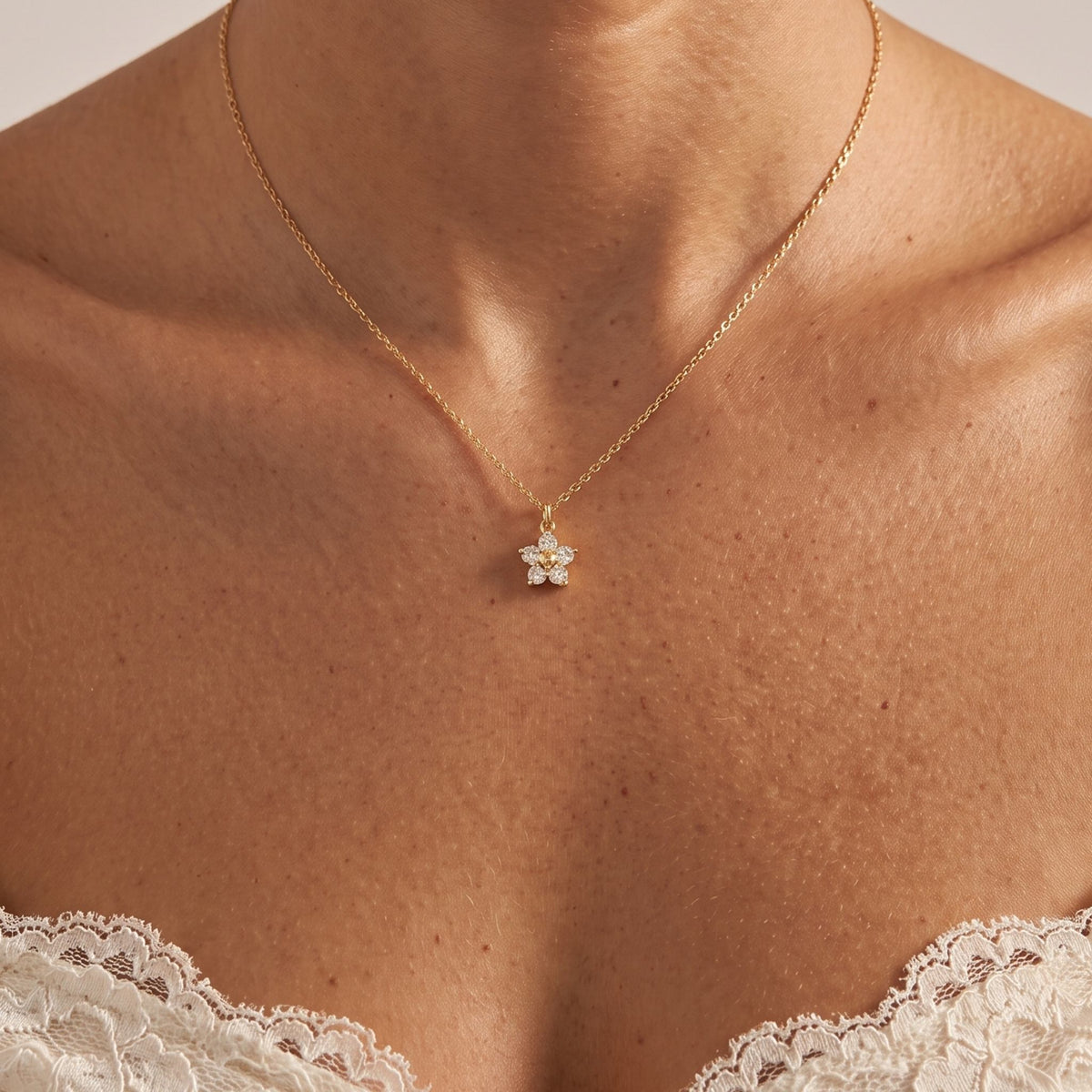 Close-up of the Gold Bloom Pendant worn on the neckline