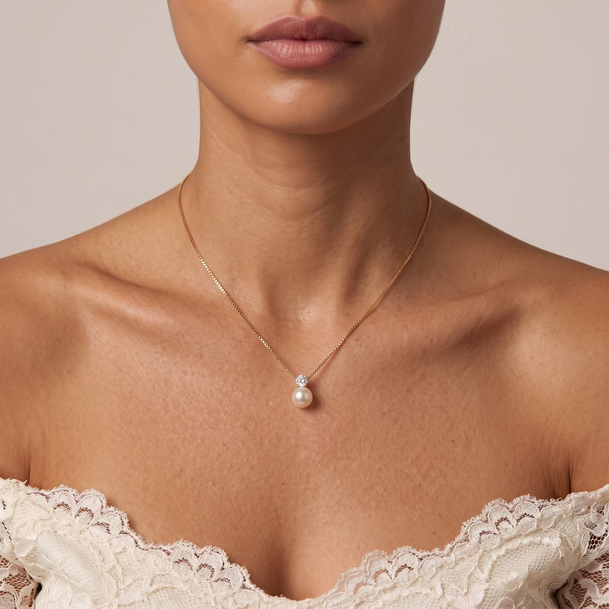 Wider view of a woman wearing the Gold Pearl Pendant
