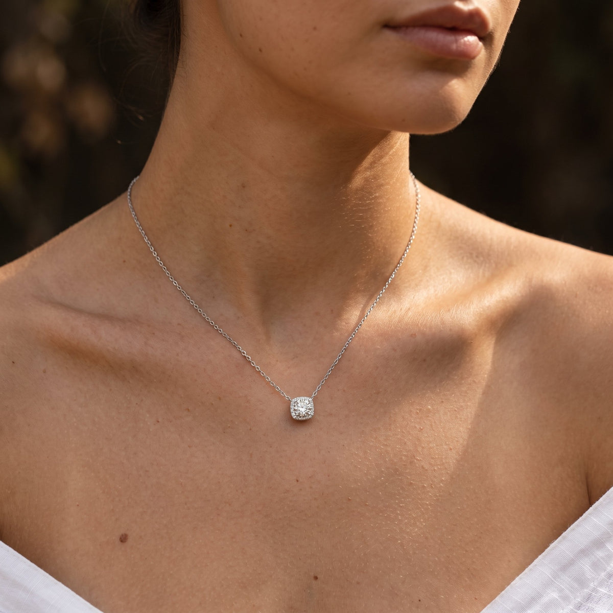 Wider view of a woman wearing the Halo Slider Pendant