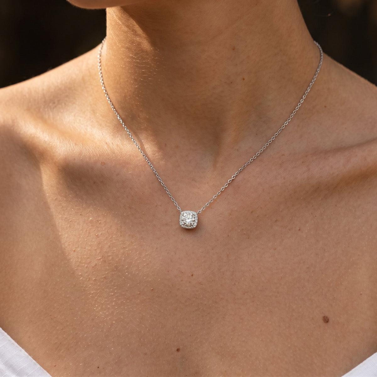 Close-up of the Halo Slider Pendant worn on the neckline