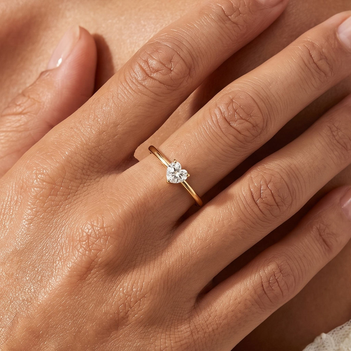 Close-up of the Heart Solitaire Ring worn on the finger
