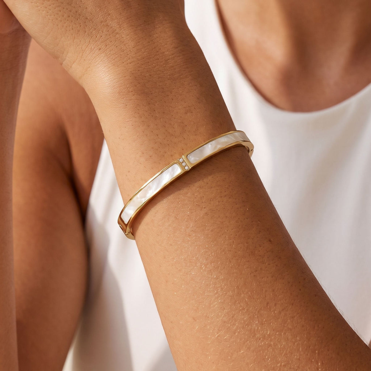 Inlay Panel Bangle worn on the wrist, photographed in natural daylight.
