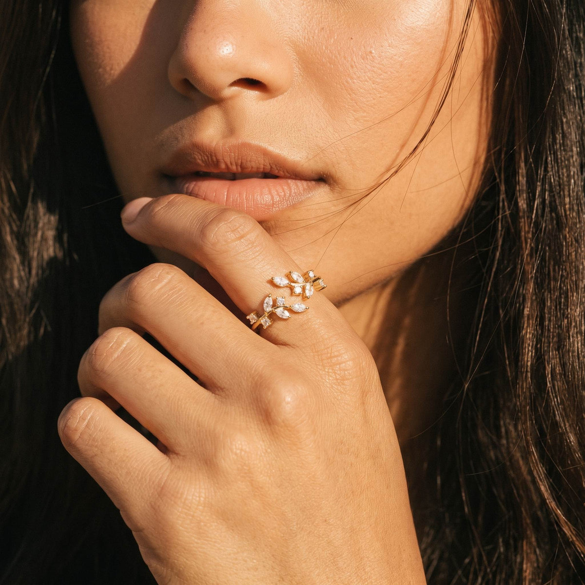 Wider view of a hand wearing the Laurel Wrap Ring