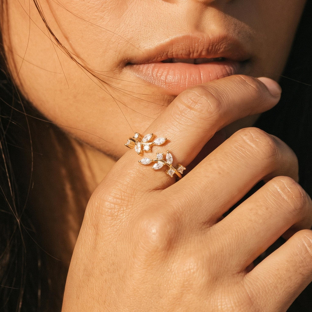 Close-up of the Laurel Wrap Ring worn on the finger