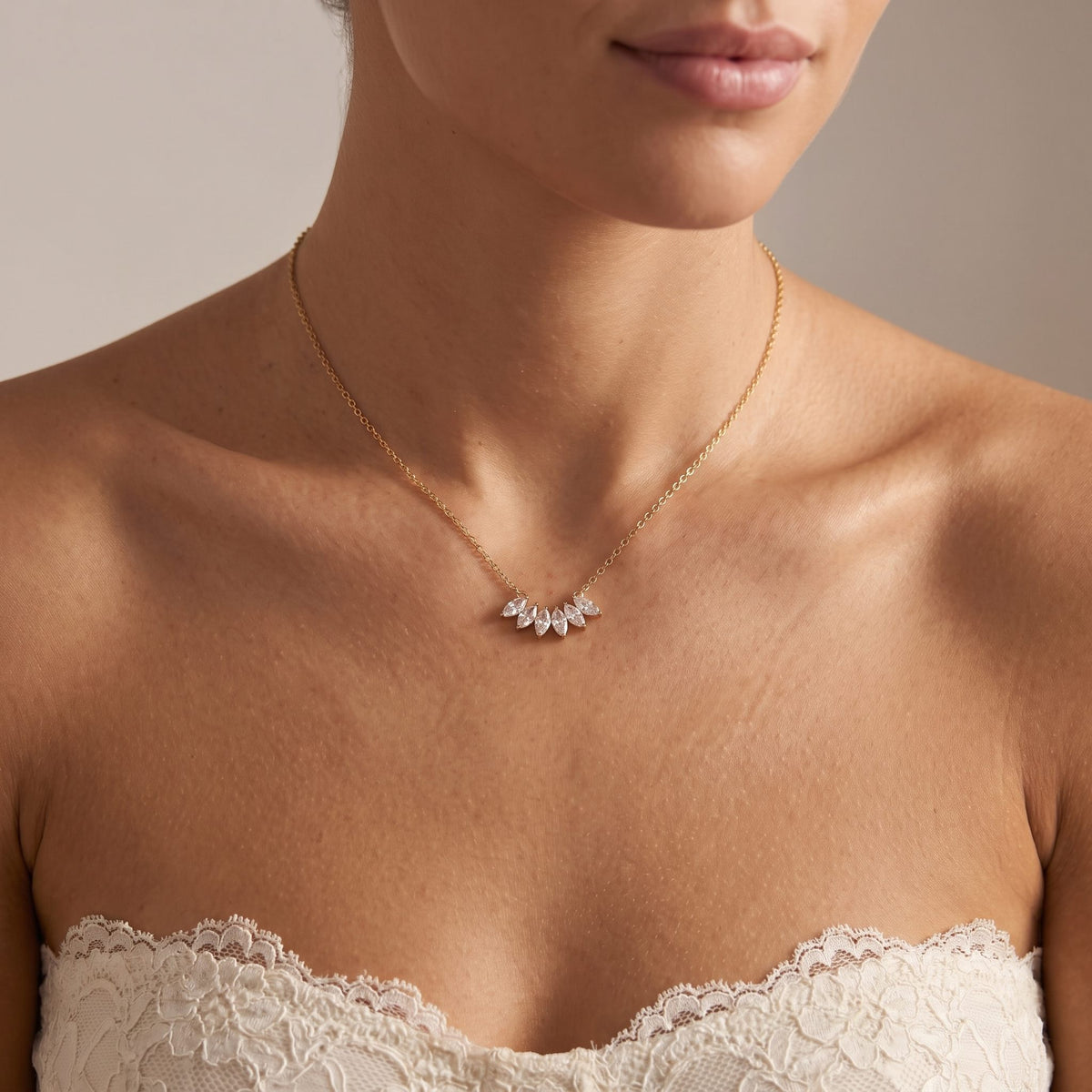 Wider view of a woman wearing the Marquise Fan Necklace
