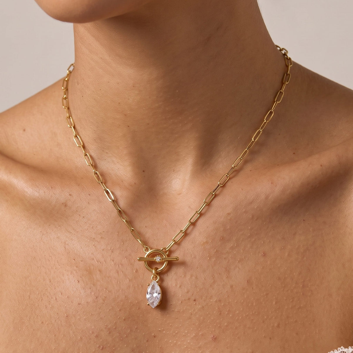 Close-up of the Marquise Toggle Necklace at the collarbone, highlighting its sparkling marquise crystal pendant