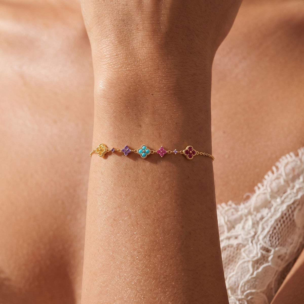 Multicolour Cluster Bracelet worn on the wrist, photographed in natural daylight.