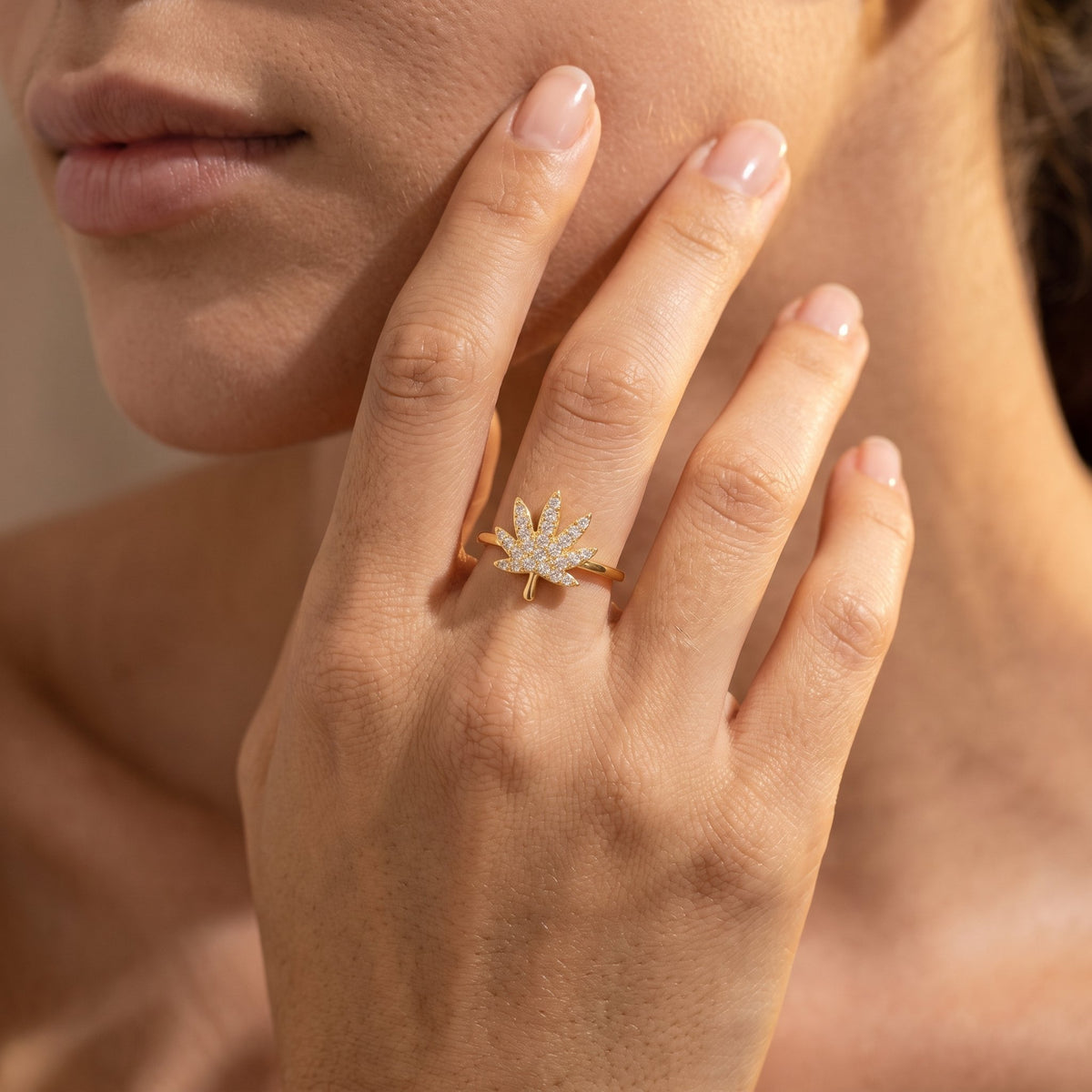 Wider view of a hand wearing the Palm Leaf Ring