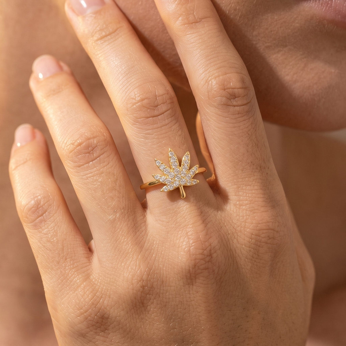 Close-up of the Palm Leaf Ring worn on the finger