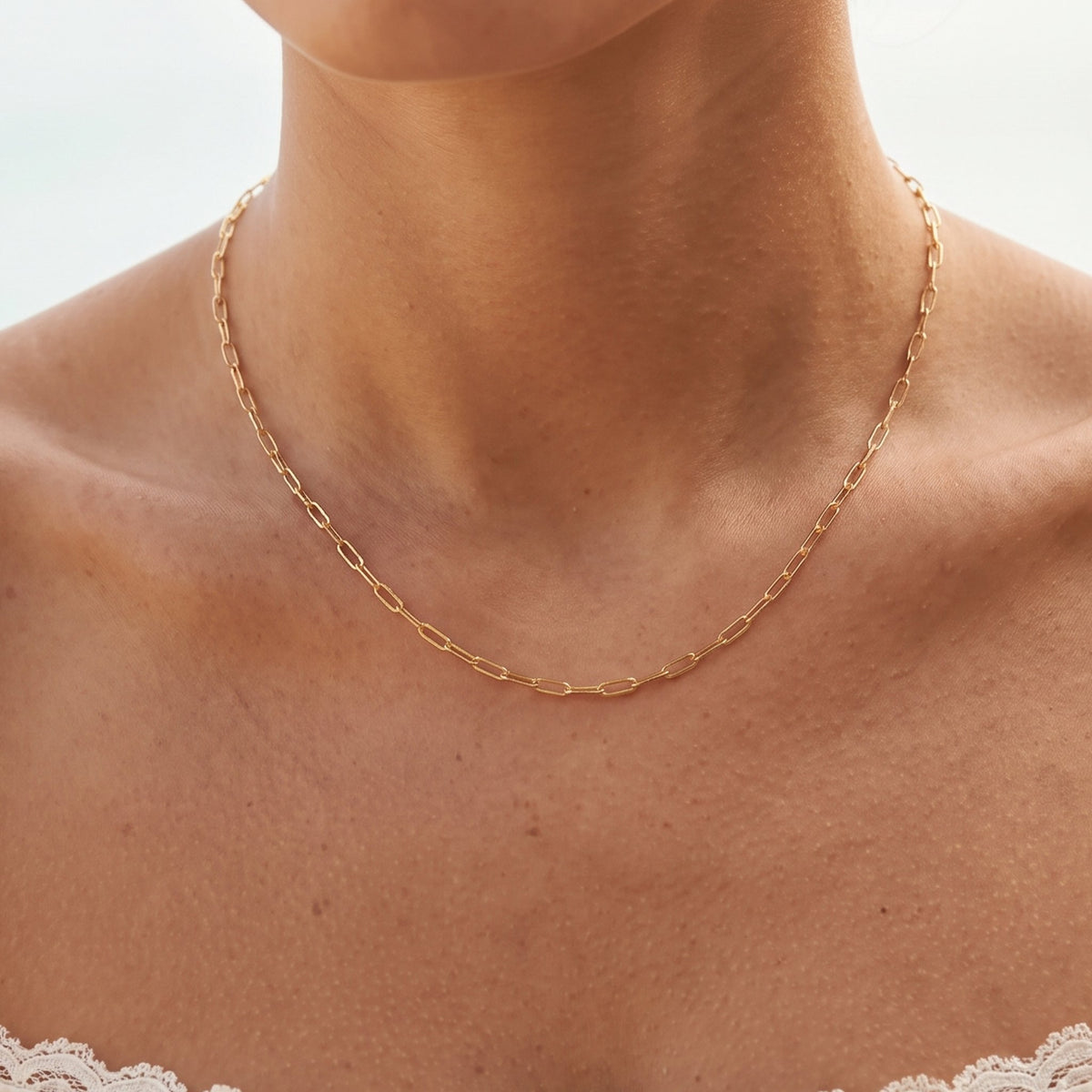 Close-up of the Paperclip Chain Necklace worn on the neckline