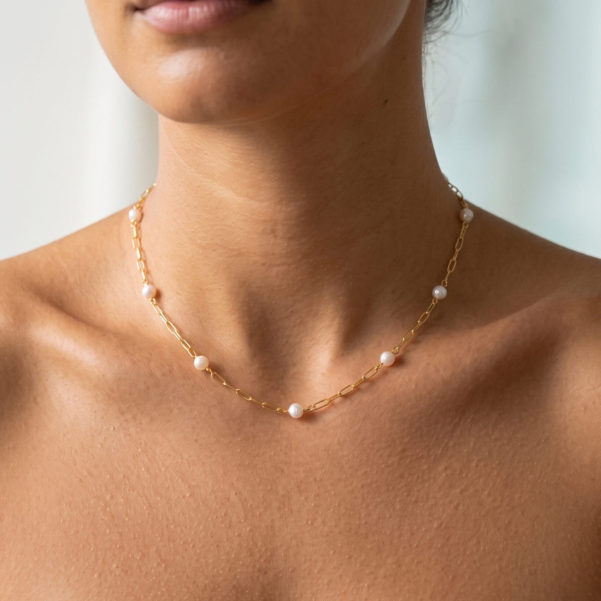 Close-up of the Paperclip Pearl Necklace worn on the neckline