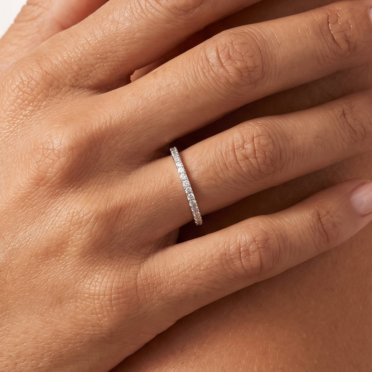 Close-up of the Pavé Eternity Ring worn on the finger