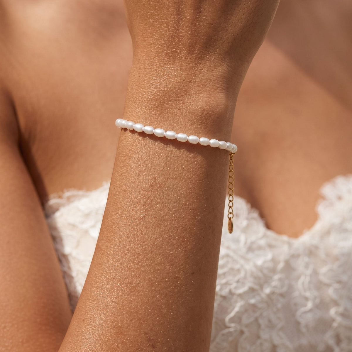 Pearl Row Bracelet worn on the wrist, photographed in natural daylight.
