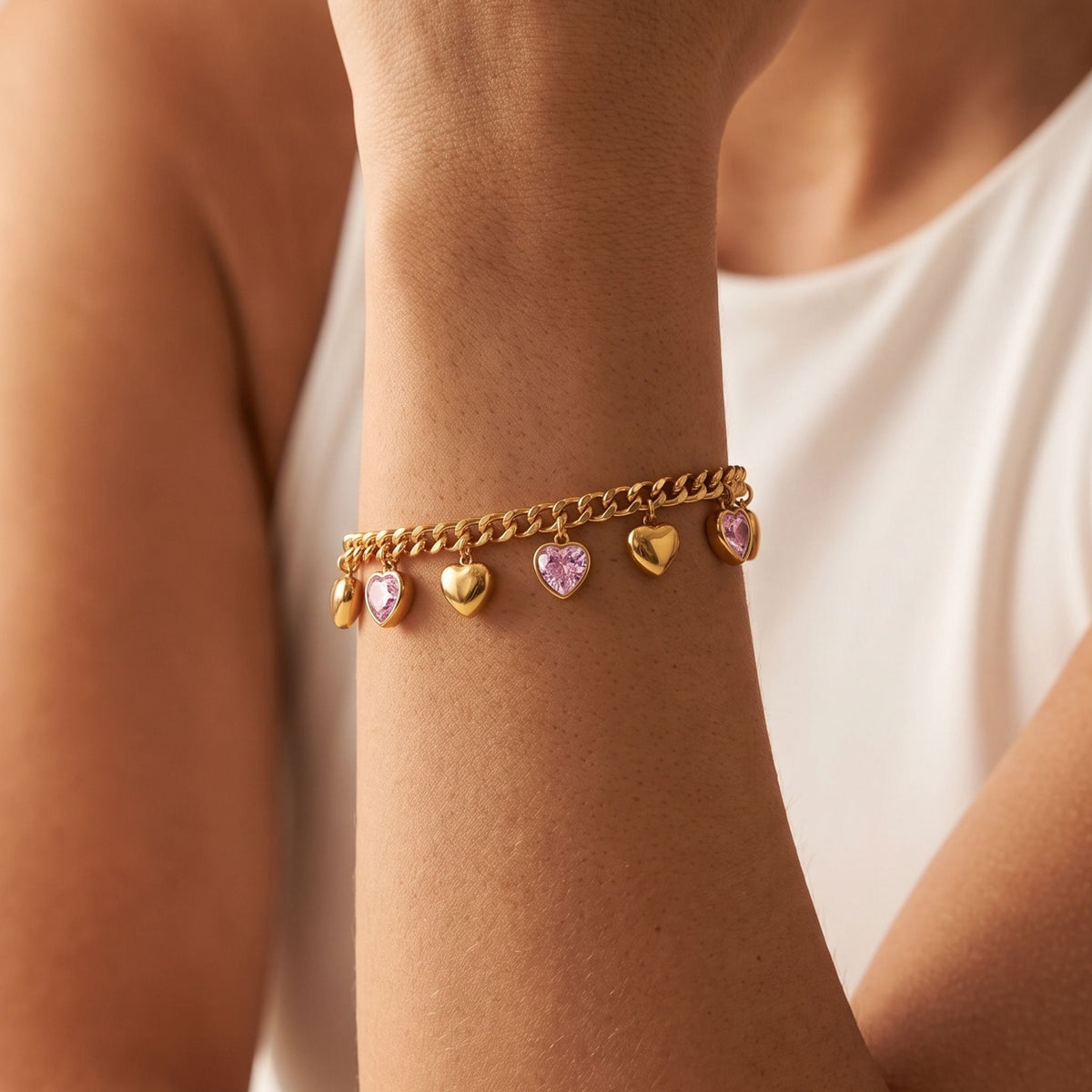 Pink Heart Bracelet worn on the wrist, photographed in natural daylight.