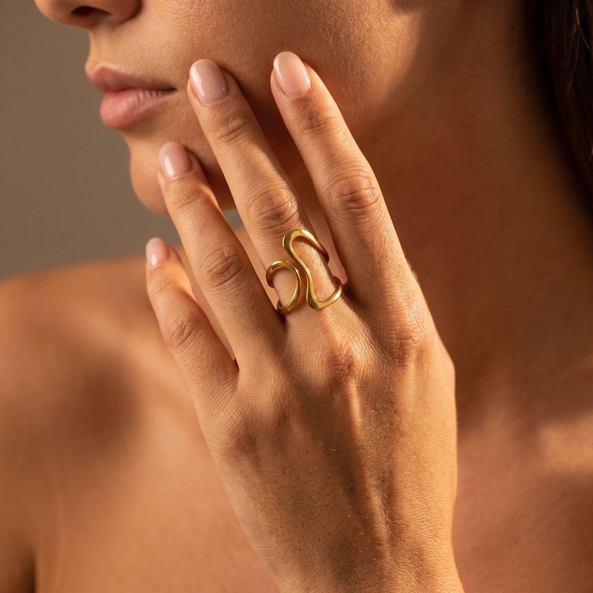 Wider view of a hand wearing the Ribbon Ring