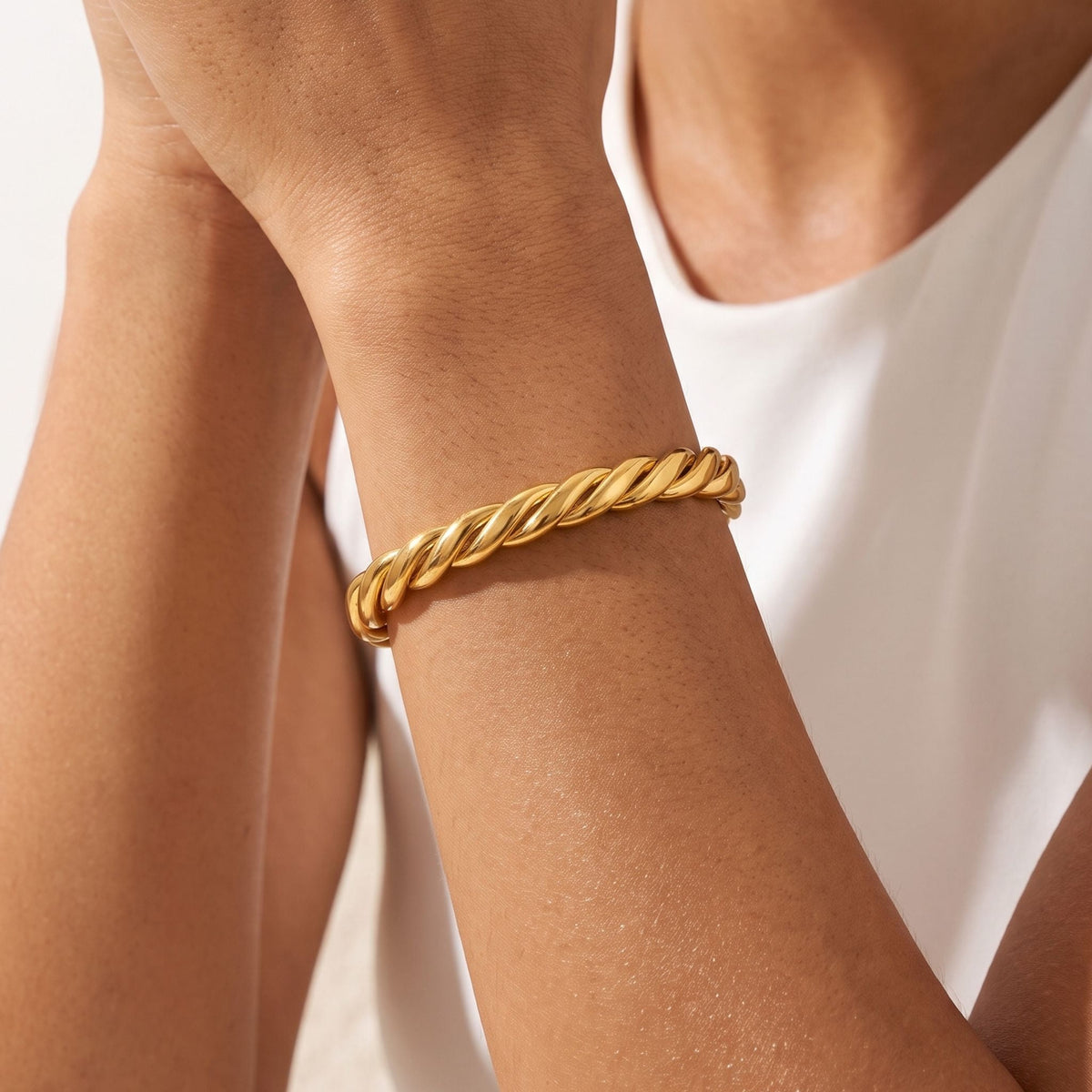 Rope Twist Bangle worn on the wrist, photographed in natural daylight.