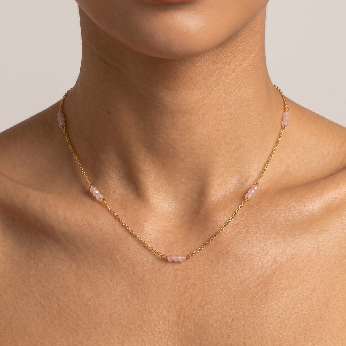 Close-up of the Rose Bead Necklace worn on the neckline