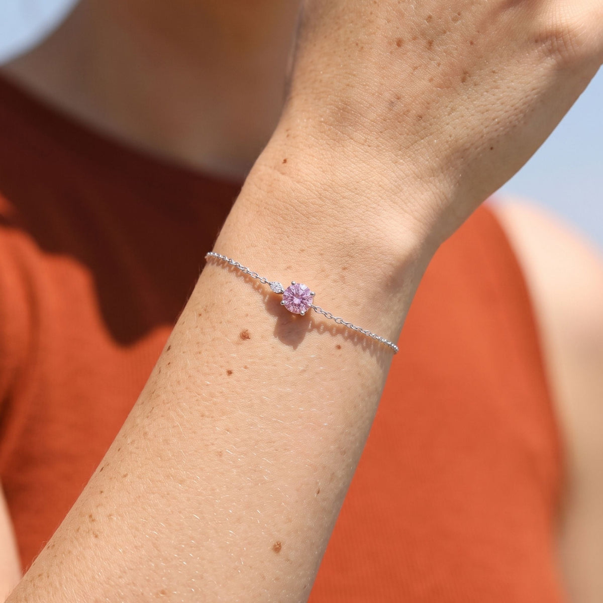Rose Solitaire Bracelet worn on the wrist, photographed in natural daylight.