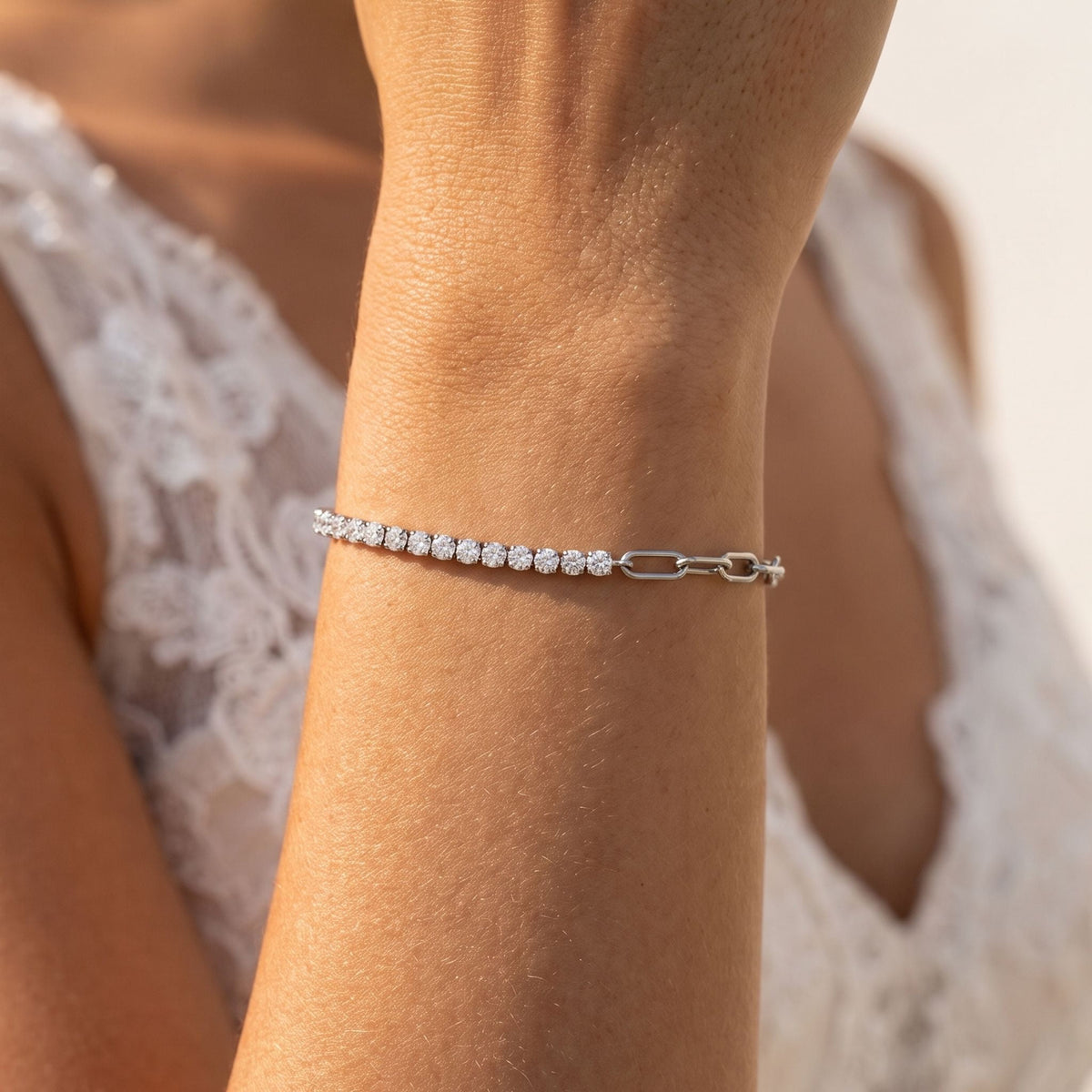 Silver Split Tennis Bracelet worn on the wrist, photographed in natural daylight.