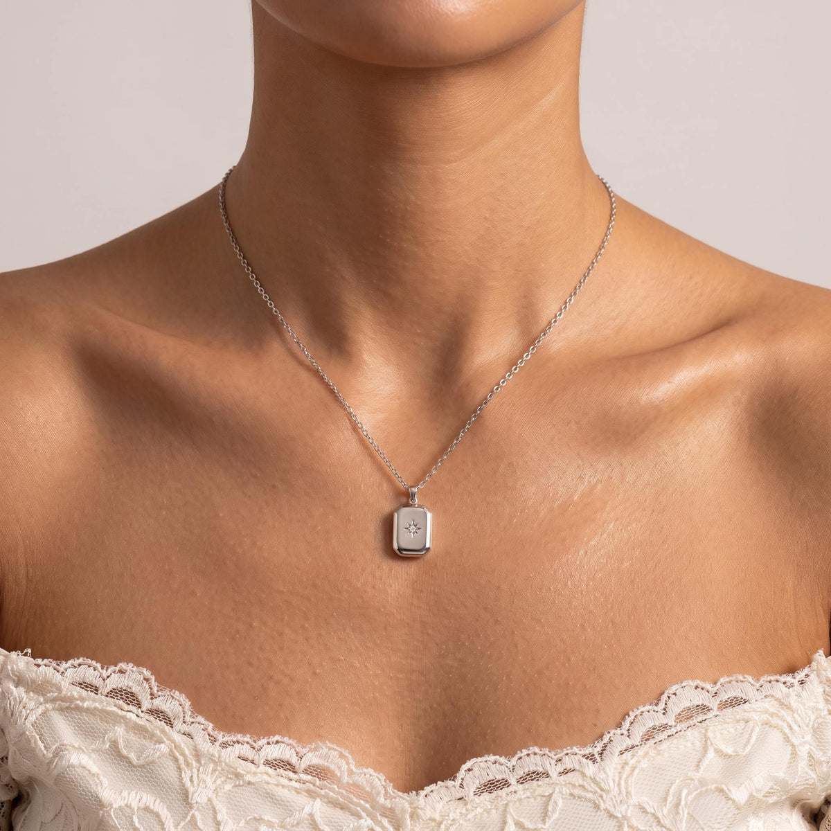 Wider view of a woman wearing the Silver Star Pendant
