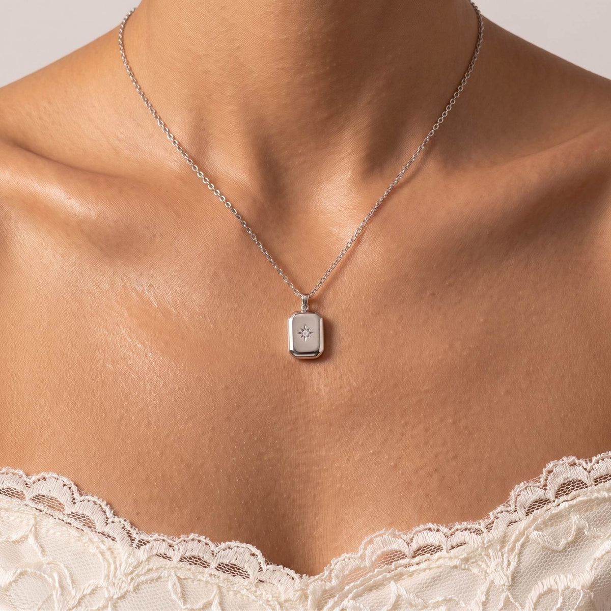 Close-up of the Silver Star Pendant worn on the neckline