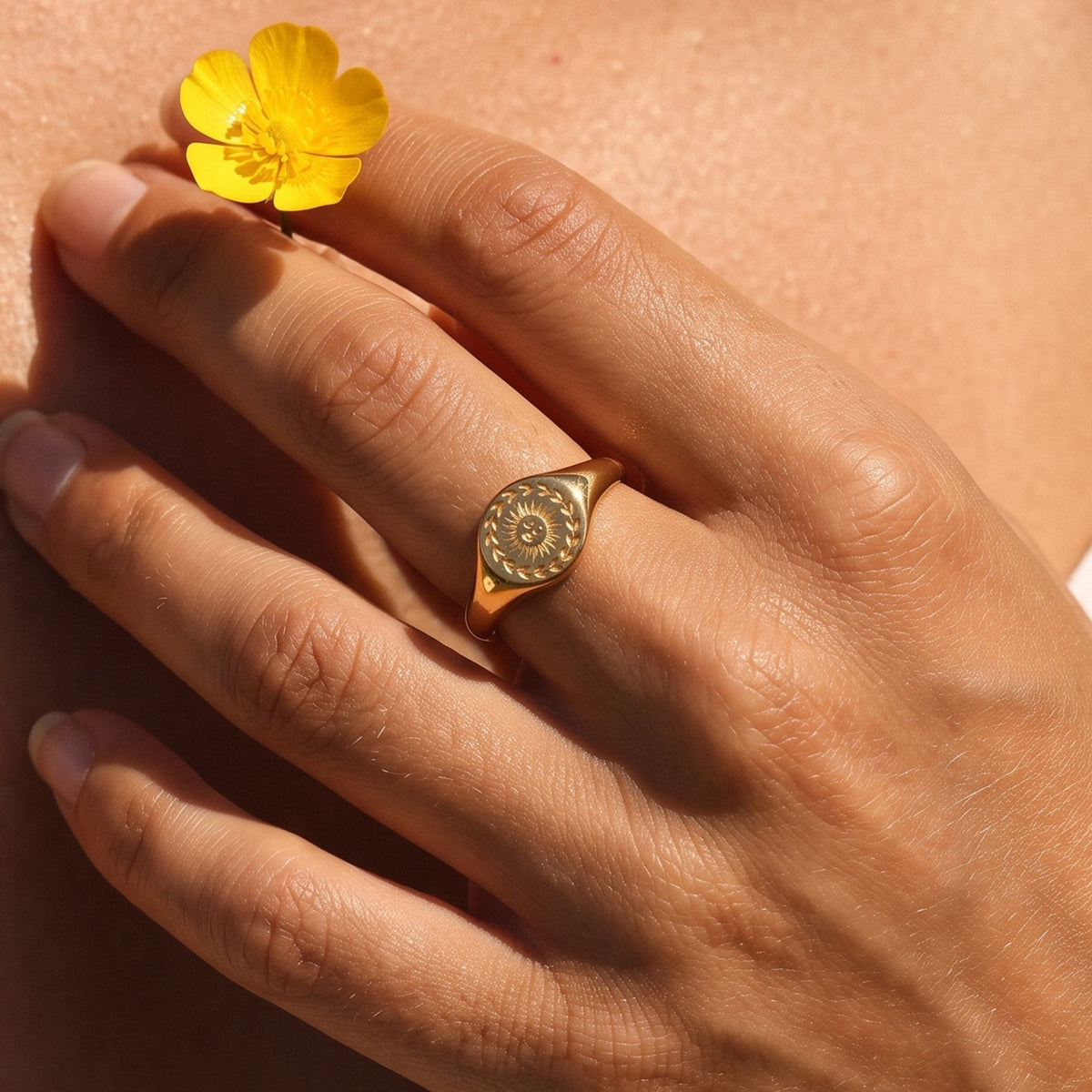 Close-up of the Sole Signet Ring worn on the finger