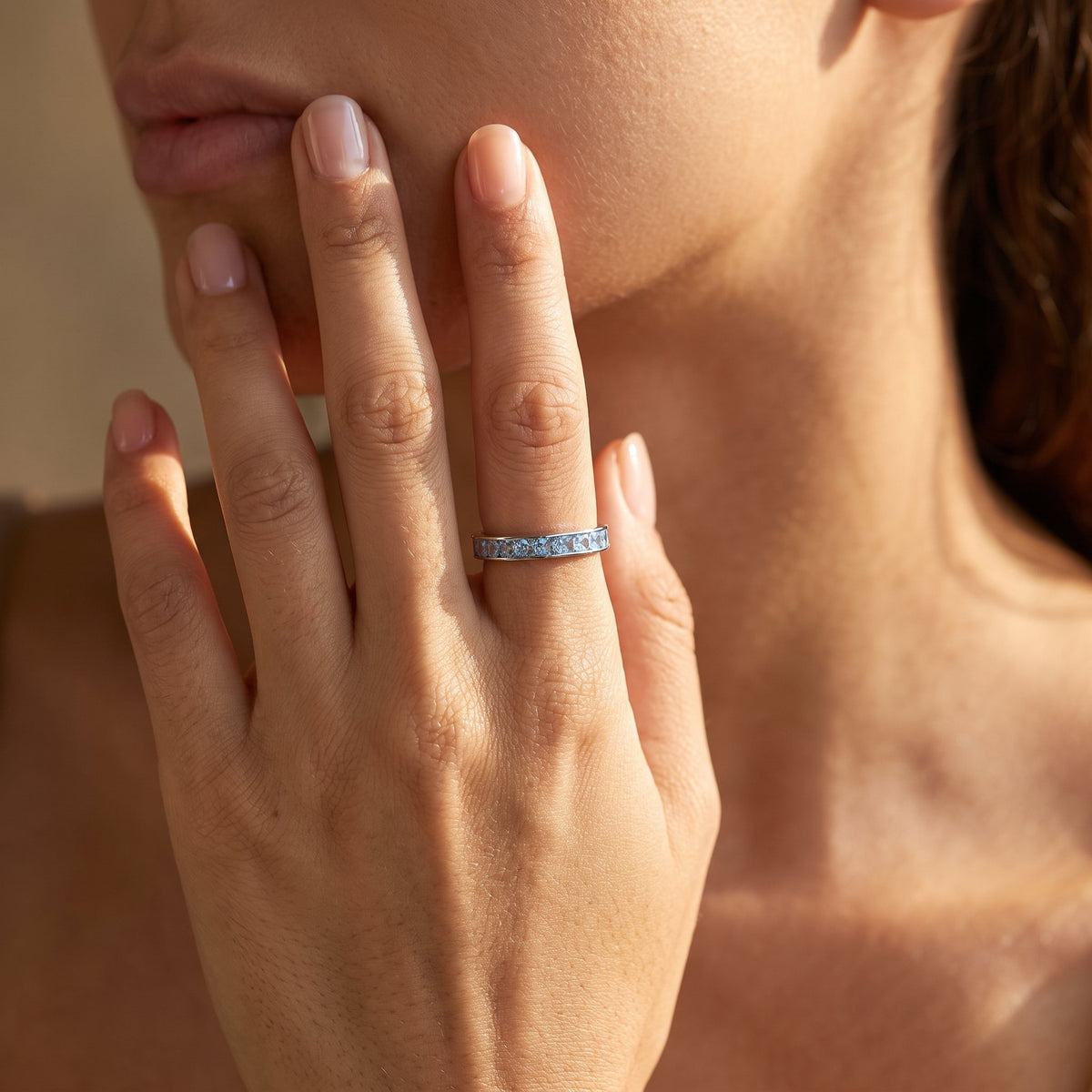 Wider view of a hand wearing the Square Channel Ring