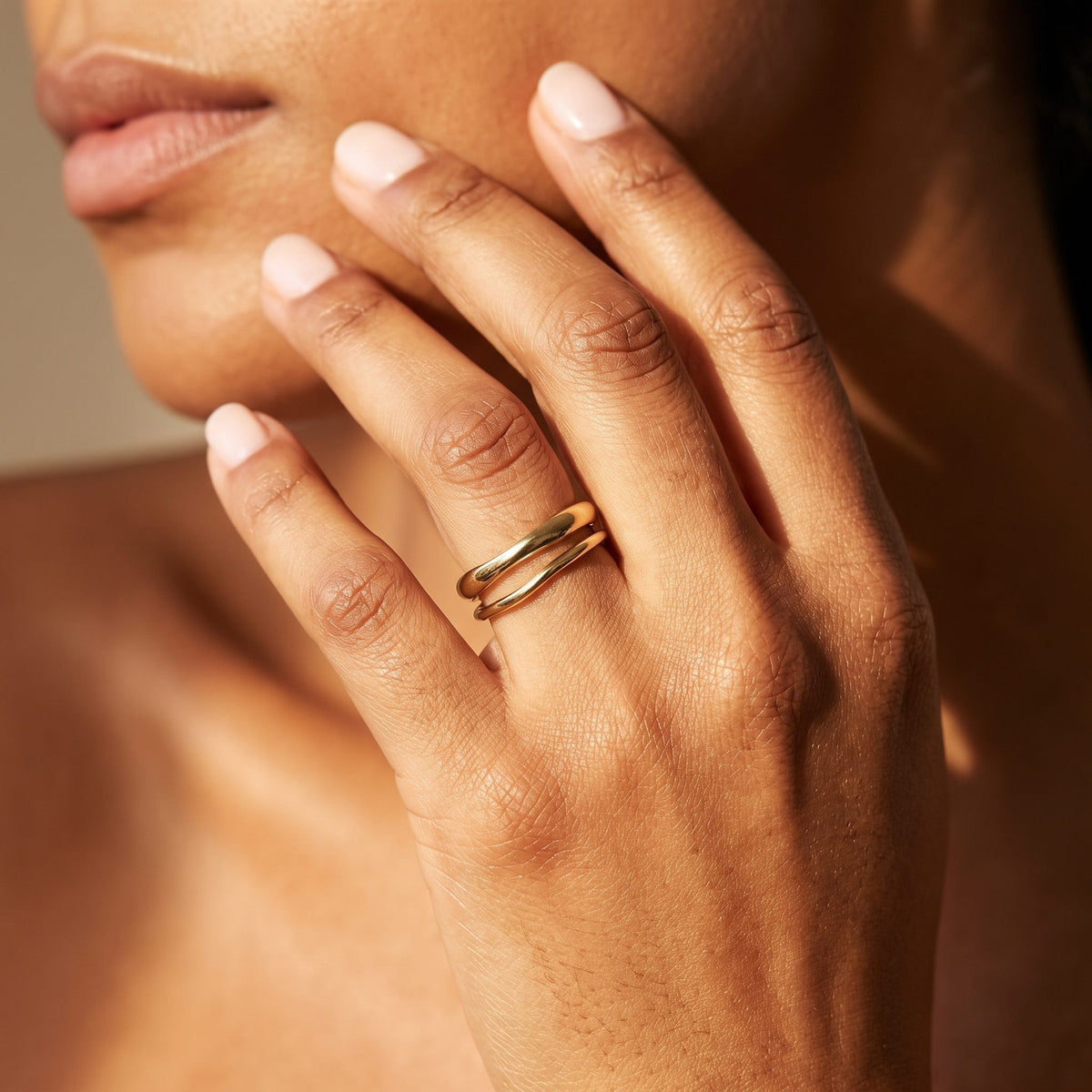 Wider view of a hand wearing the Stacking Ring Set