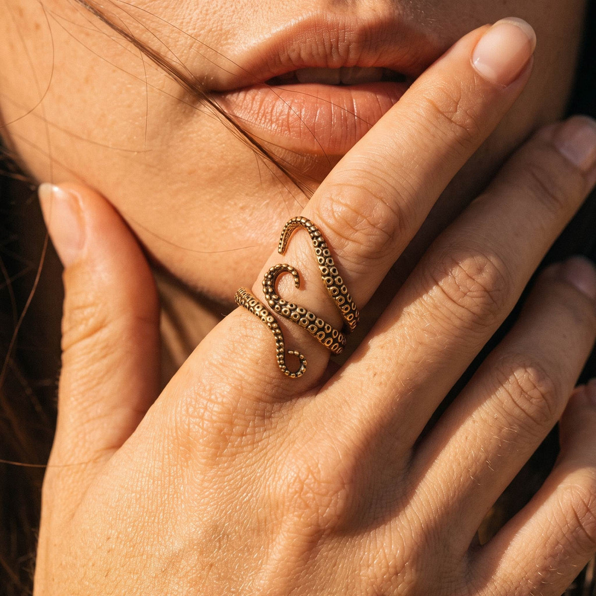 Close-up of the Tentacle Ring worn on the finger
