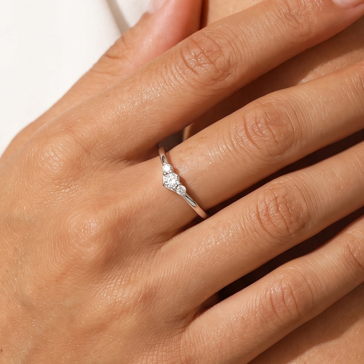 Close-up of the Trilogy Ring worn on the finger