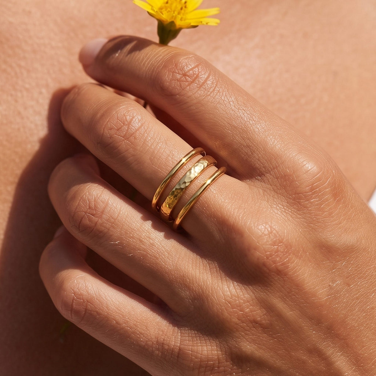 Close-up of the Triple Band Ring worn on the finger