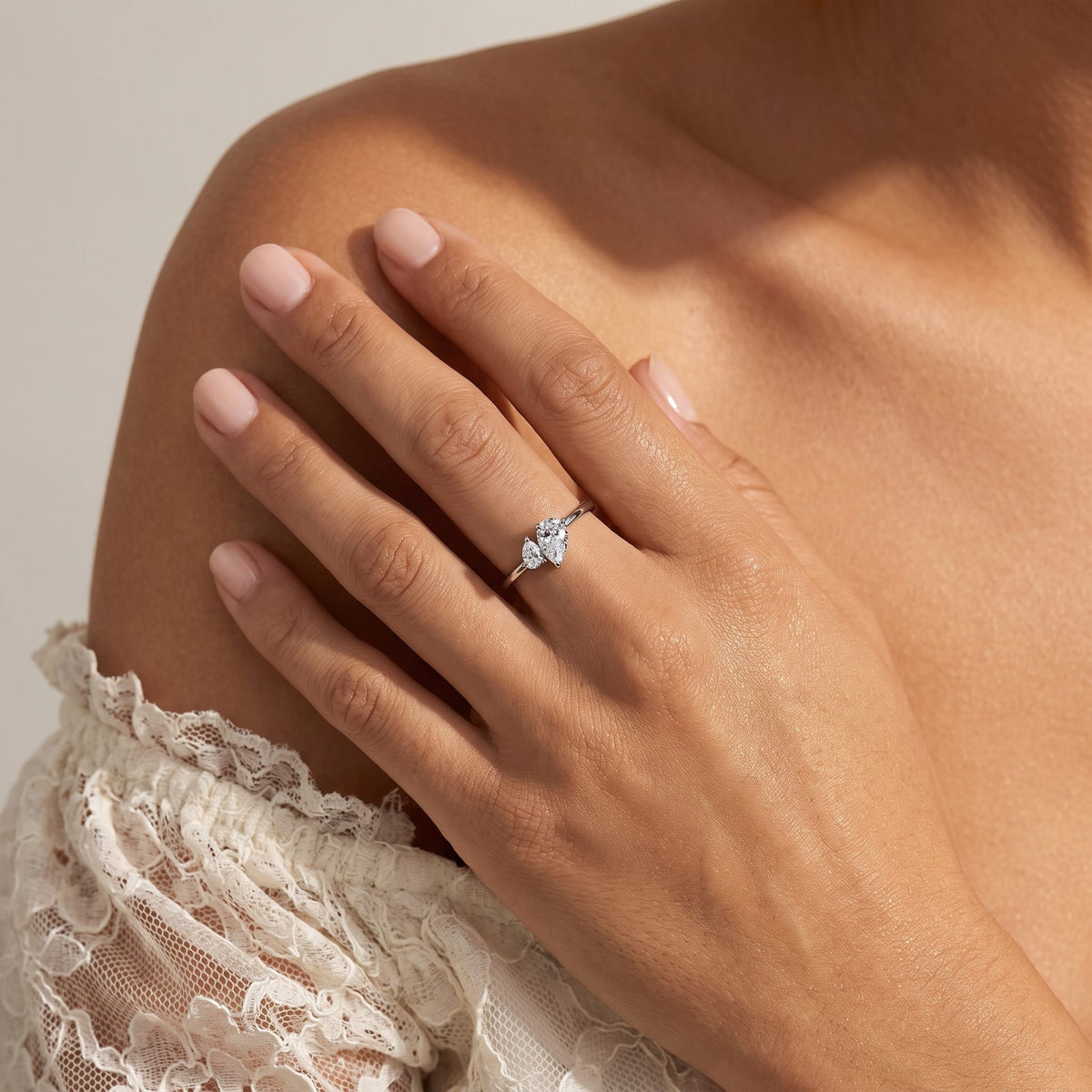 Wider view of a hand wearing the Twin Pear Ring