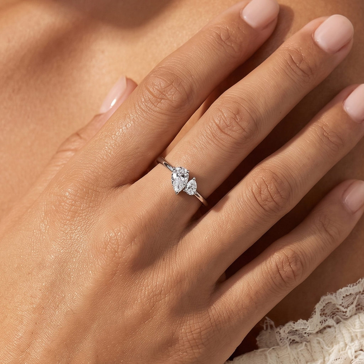 Close-up of the Twin Pear Ring worn on the finger