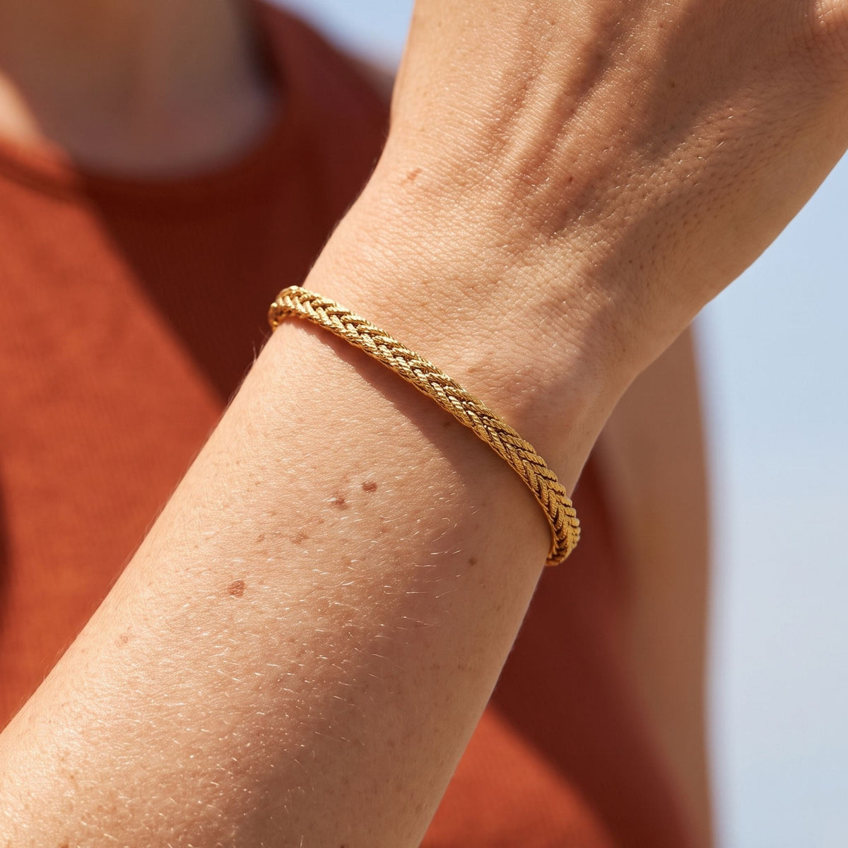 Wheat Braid Bracelet worn on the wrist, photographed in natural daylight.