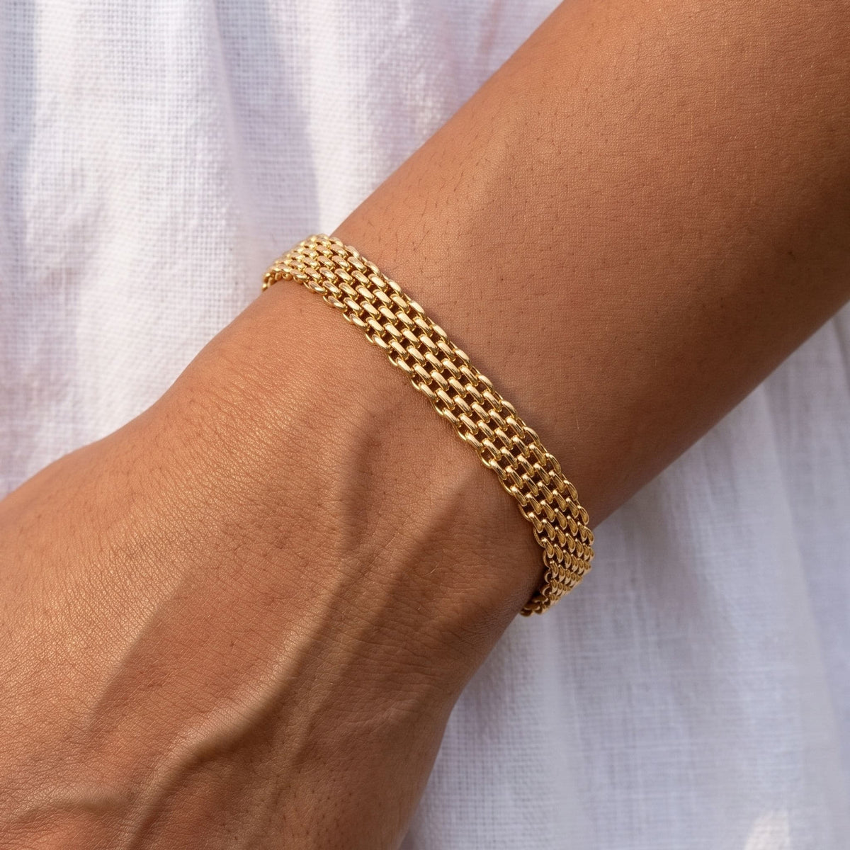 Woven Panel Bracelet worn on the wrist, photographed in natural daylight.